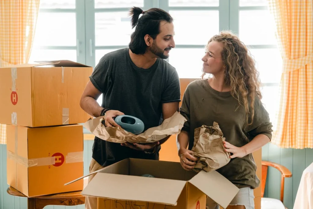 A couple packing their stuff in boxes