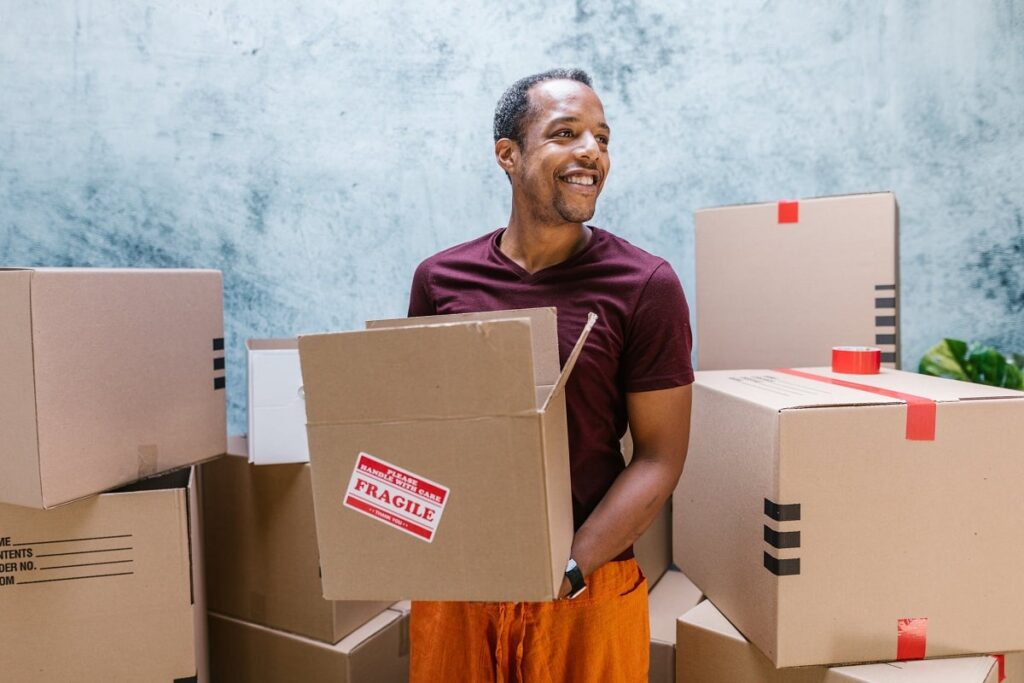 movers surrounded by boxes