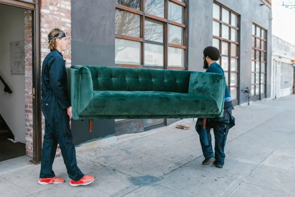 two movers carrying sofa