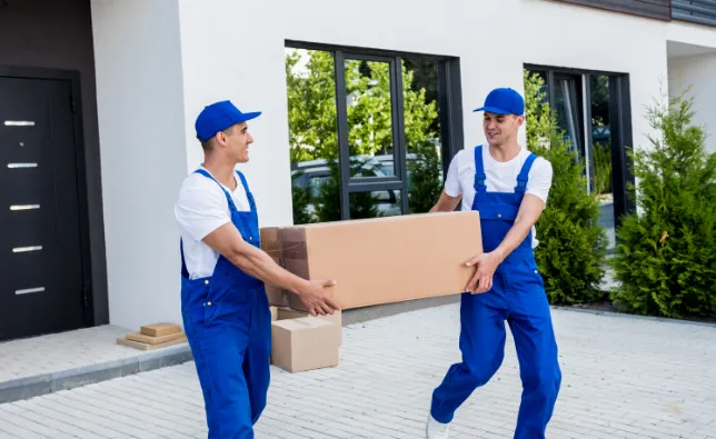 Two movers carrying a large box